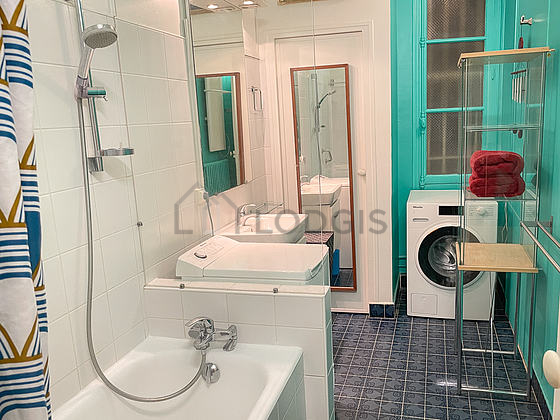 Beautiful bathroom with double-glazed windows and with tile floor