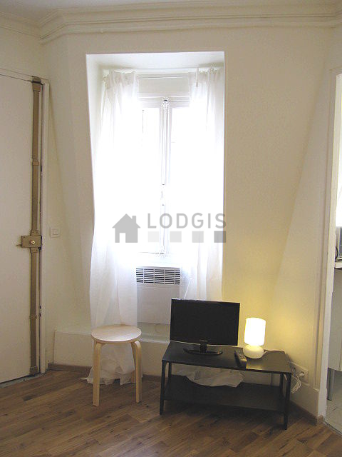 Living room with windows facing the courtyard