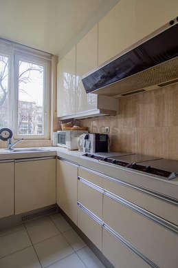 Kitchen where you can have dinner for 3 person(s) equipped with washing machine, dryer, refrigerator, extractor hood