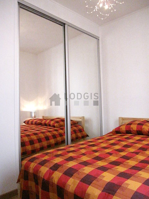 Bedroom with wooden floor