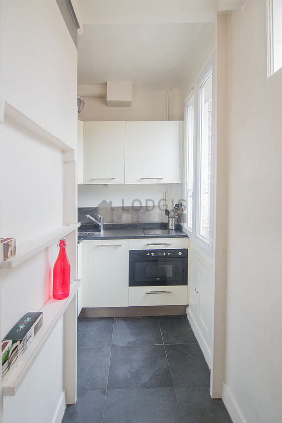 Beautiful kitchenopens on the living room with a slate floor