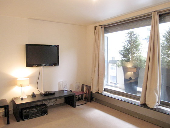 Very quiet living room furnished with 1 bed(s) of 180cm, tv, hi-fi stereo, wardrobe