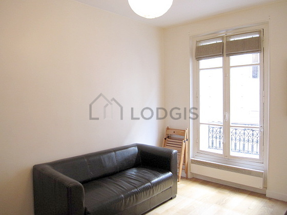 Quiet living room furnished with tv, 2 chair(s)
