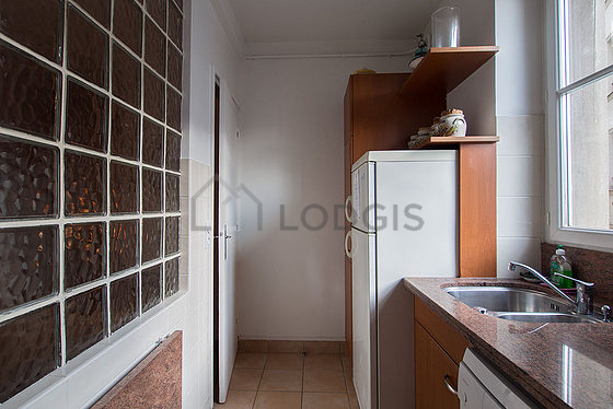 Bright kitchen with double-glazed windows facing the courtyard