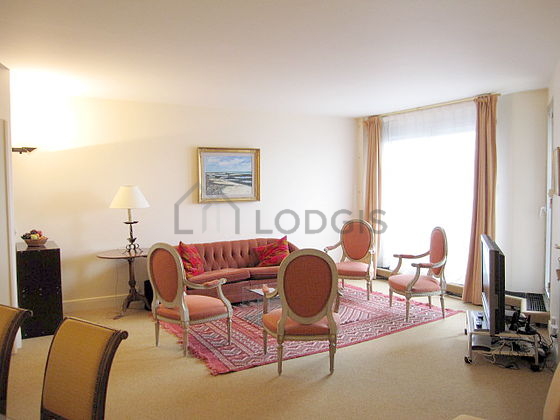 Very quiet living room furnished with tv, 4 armchair(s), 6 chair(s)