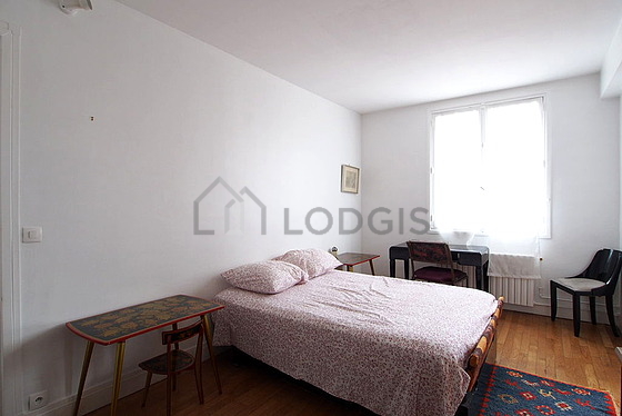 Bedroom with wooden floor