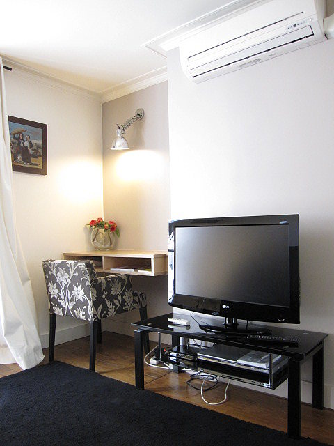 Living room with double-glazed windows facing the courtyard