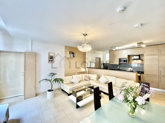 Living room with double-glazed windows facing the road