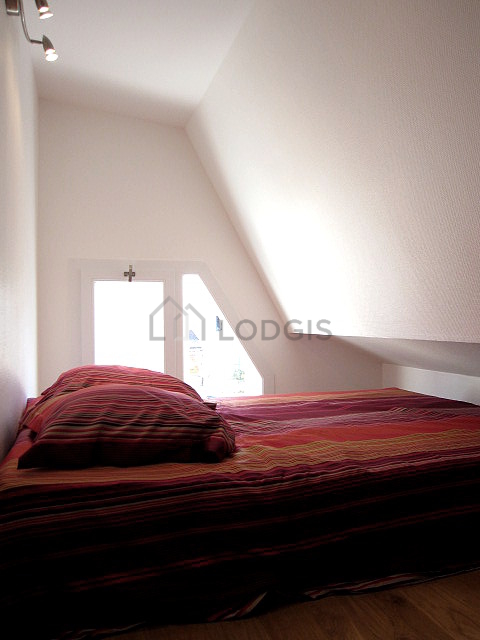 Mezzanine with a high ceiling with wooden floor