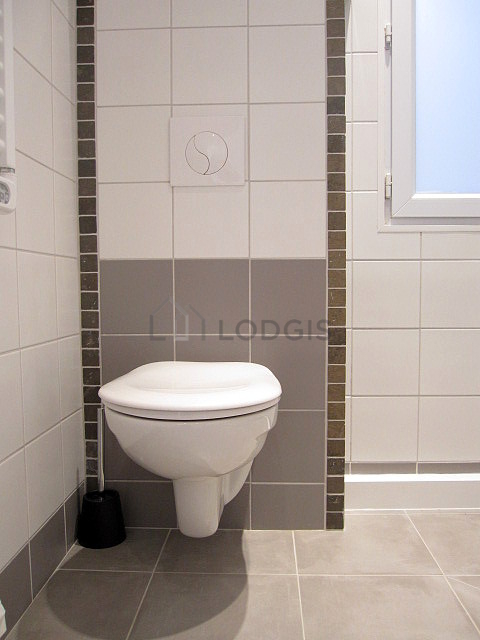 Beautiful and bright bathroom with double-glazed windows and with wooden floor