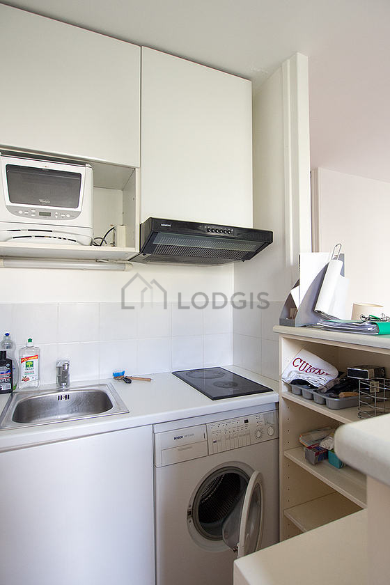 Kitchen equipped with washing machine, dryer, refrigerator, crockery