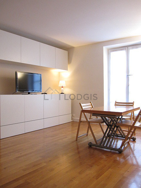 Living room with double-glazed windows facing the road
