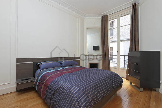 Bedroom with wooden floor