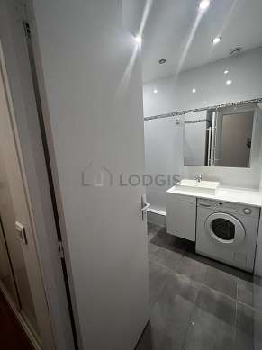 Bathroom equipped with washing machine, dryer, cupboard