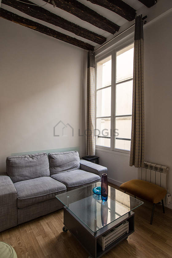 Quiet living room furnished with tv, 3 chair(s)