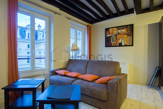 Living room with double-glazed windows facing the road