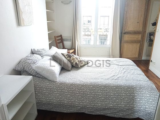 Bedroom with double-glazed windows and balcony facing the road