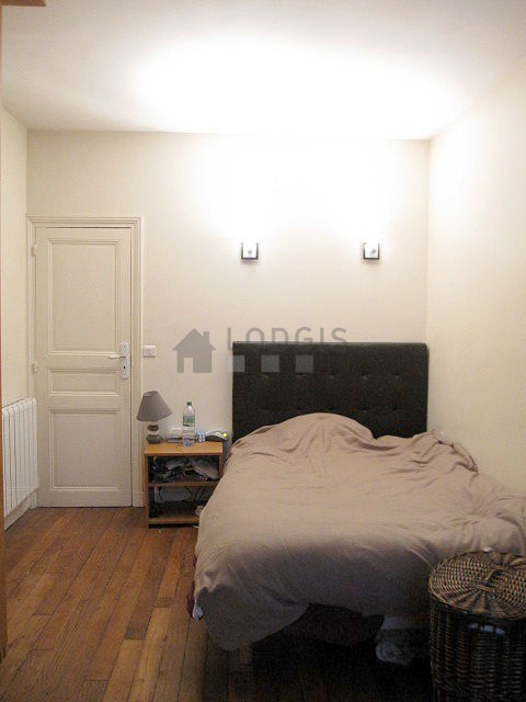 Bedroom with wooden floor