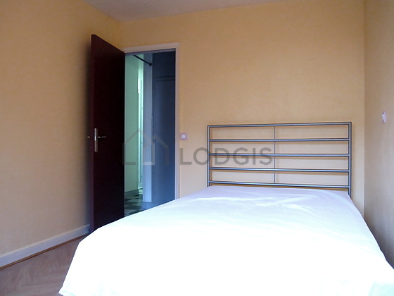 Bedroom with wooden floor