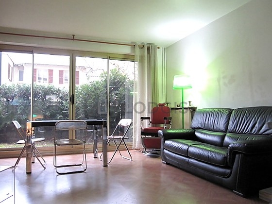 Living room with double-glazed windows facing the garden