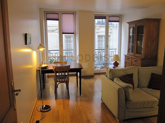 Quiet living room furnished with tv, 4 chair(s)