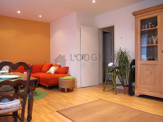 Living room with double-glazed windows facing the road