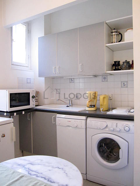 Bright kitchen with windows facing the courtyard