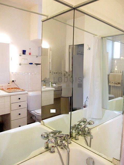 Bathroom equipped with washing machine, bath towels