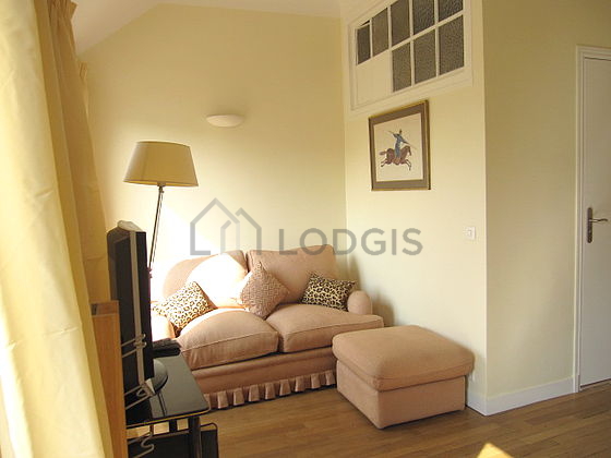 Living room with double-glazed windows and balcony facing the road