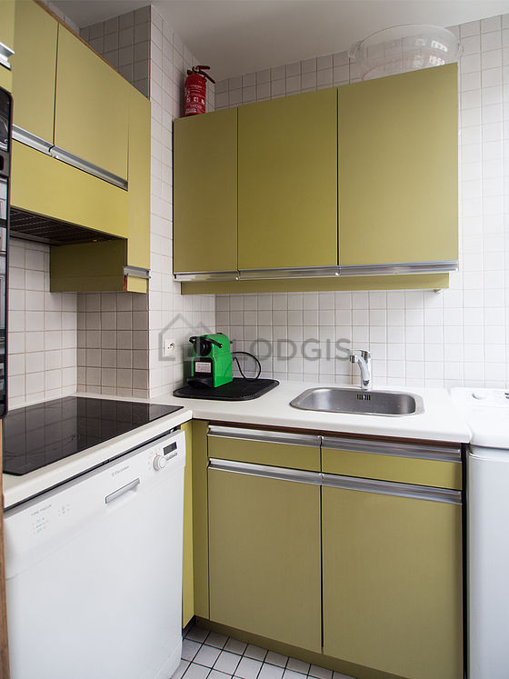 Kitchen equipped with washing machine, refrigerator, freezer, extractor hood