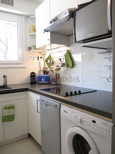Bright kitchen with windows facing the road
