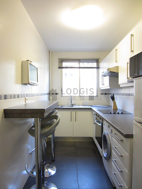 Kitchen where you can have dinner for 2 person(s) equipped with washing machine, dryer, refrigerator, extractor hood