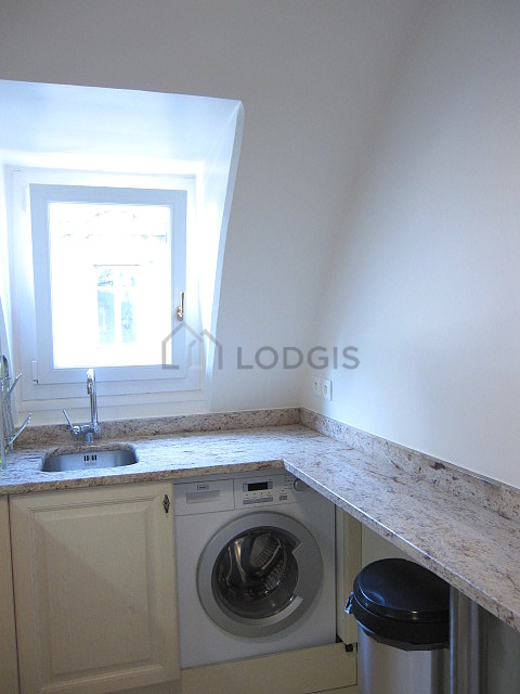 Bright kitchen with windows facing the road