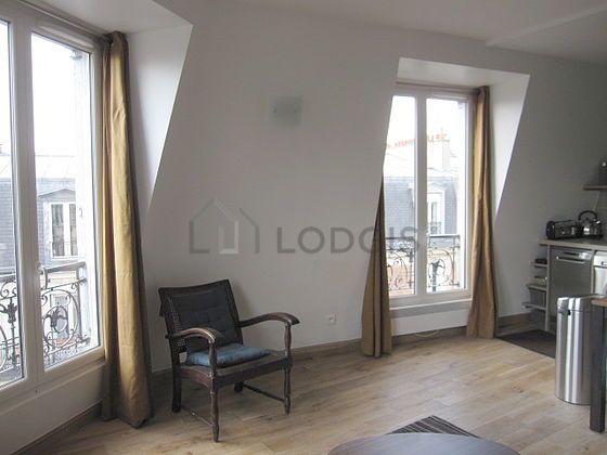 Living room with double-glazed windows facing the road