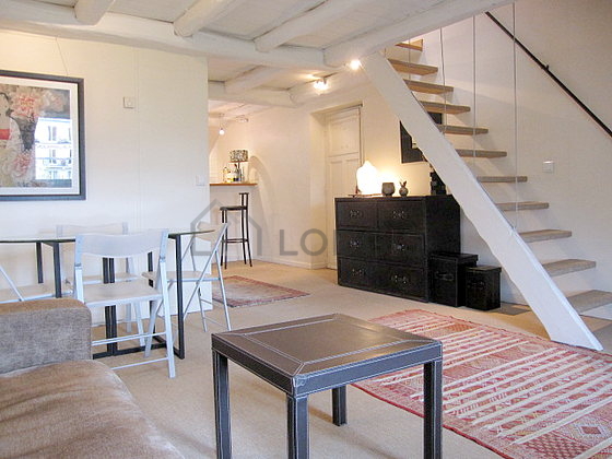 Living room with double-glazed windows facing the road