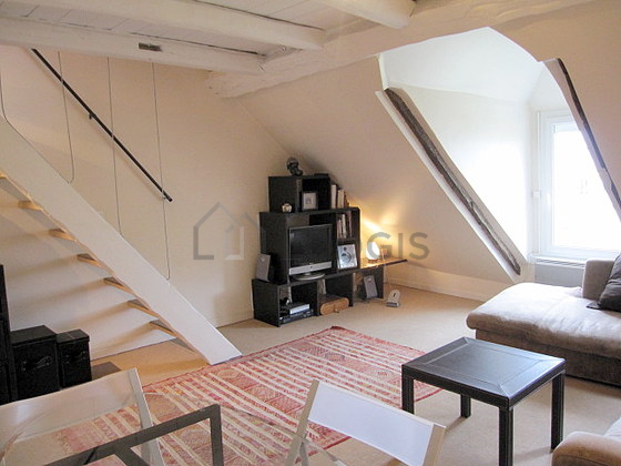 Bright living room furnished with cupboard, 4 chair(s)