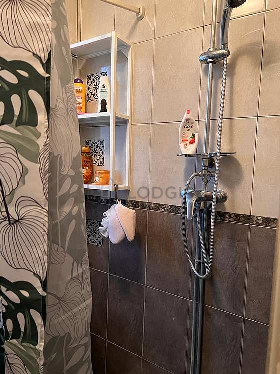 Bathroom with double-glazed windows and with tile floor