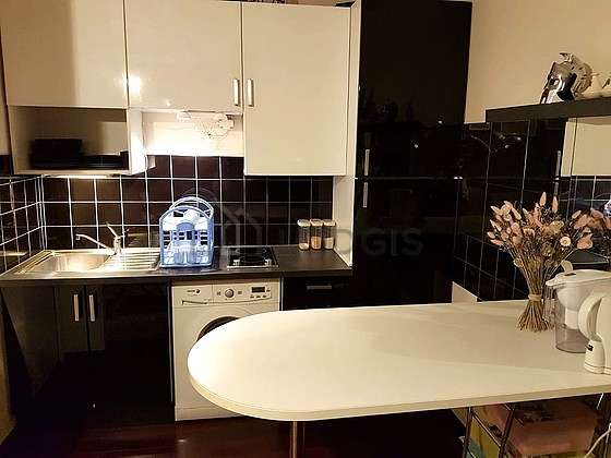 Kitchen where you can have dinner for 2 person(s) equipped with washing machine, dryer, refrigerator, crockery