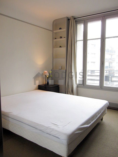 Bedroom with windows facing the courtyard