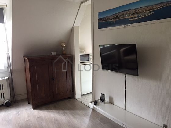 Living room with windows facing the road