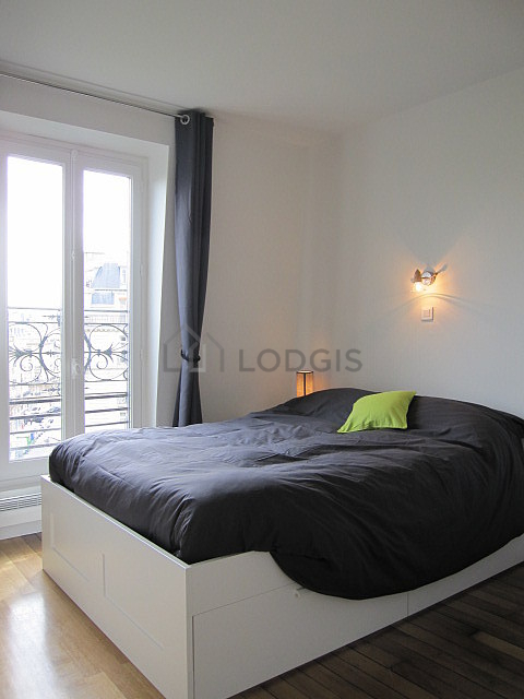 Bedroom with double-glazed windows facing the road