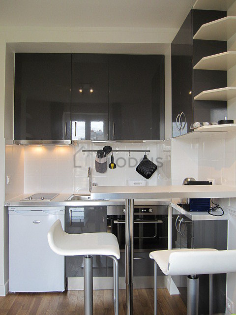Kitchen where you can have dinner for 2 person(s) equipped with hob, refrigerator, freezer, extractor hood