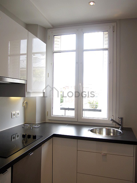 Bright kitchen with double-glazed windows facing the road