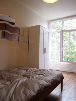 Bedroom with double-glazed windows facing the road