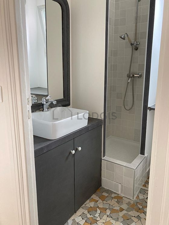 Bathroom equipped with washing machine, bath towels