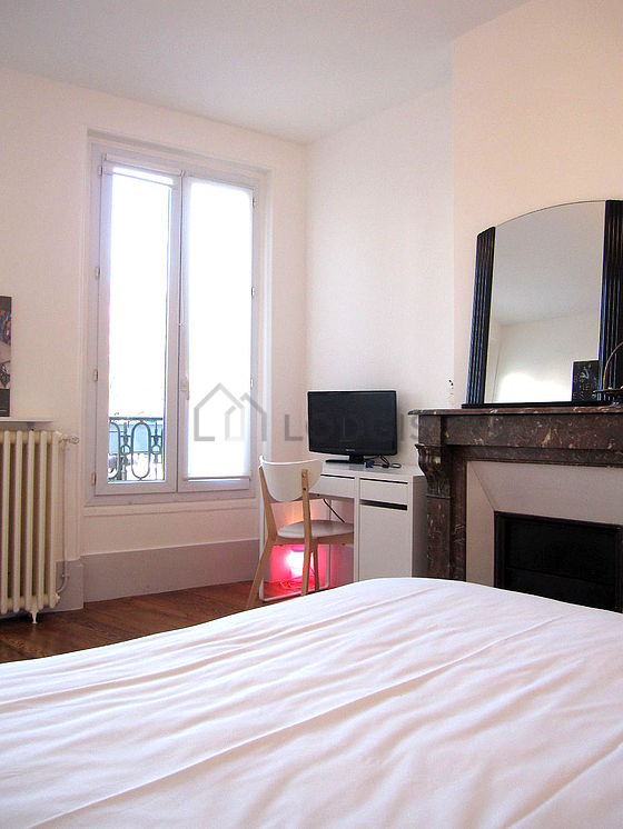 Bedroom with double-glazed windows facing the road