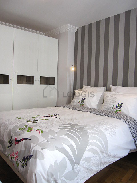 Bedroom with wooden floor
