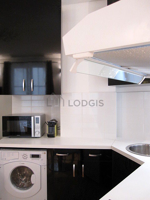 Kitchen equipped with washing machine, dryer, refrigerator, freezer