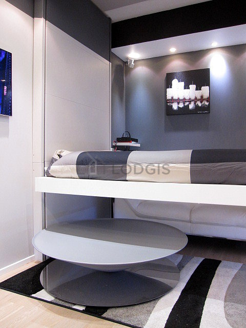 Bright living room furnished with cupboard