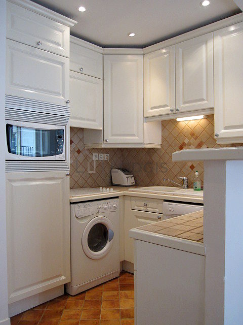 Kitchen equipped with washing machine, dryer, refrigerator, freezer